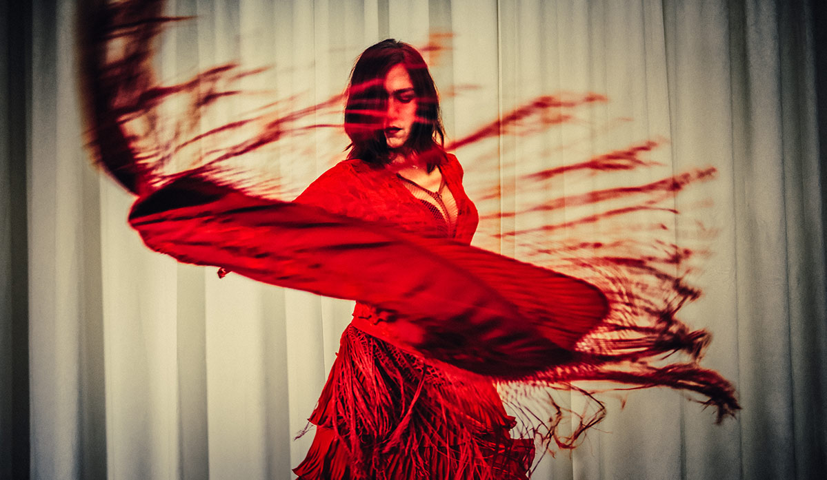 Carmen Stromae Lyrics - an image of a flamenco dancer to represent Carmen